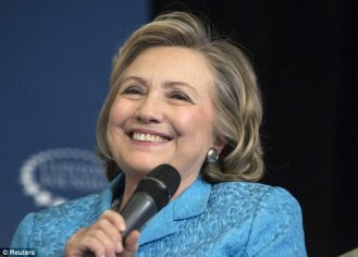 The cat out of the bag, Grandma-to-be Hillary could smile and joke.  Image by Andrew Kelly, Reuters. 