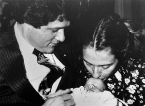 Chelsea being kissed by Mom at one week old in 1980, when Dad was Arkansas governor. Her name came from the Joni Mitchell song "Chelsea Morning." Image by Donald R. Broyles, AP.