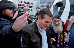 No, Vermin's the guy on the right with the boot and the giant toothbrush talking to some other crazy in New Hampshire. Image by Elise Amendola, Associated Press, found on Dallas News Trailblazers blog.